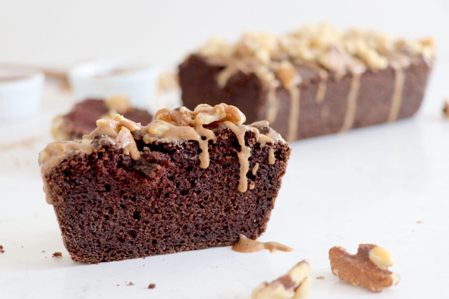 Almond flour bread with one slice in front of loaf.