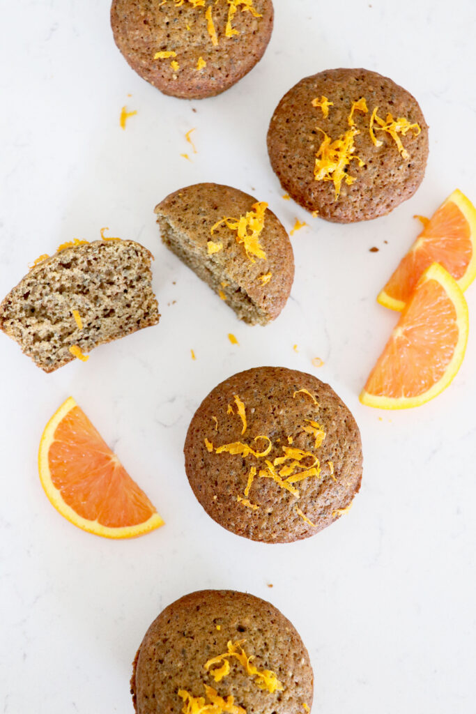 Muffins and orange slices on the side.