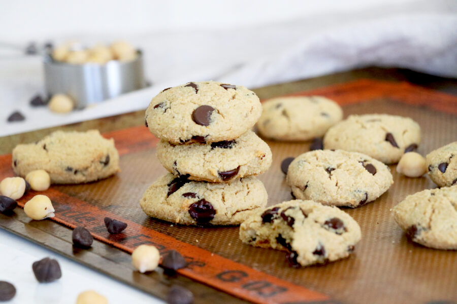 Baking sheet with stacked chocolate chip cookies
