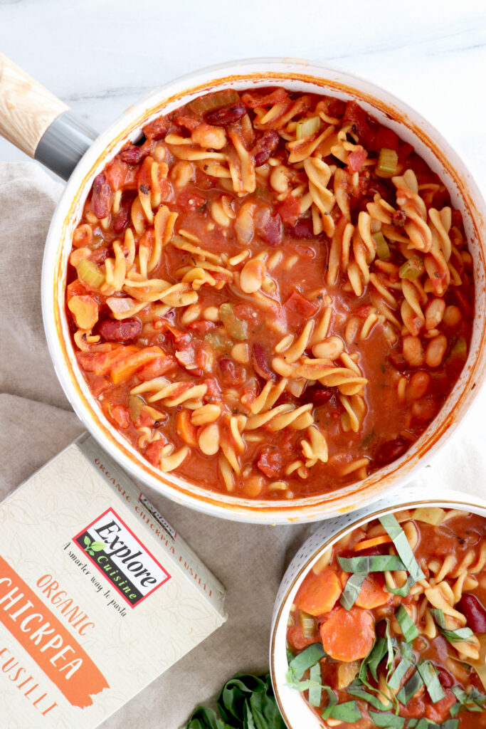 Pot of minestrone soup with veggies mixed in