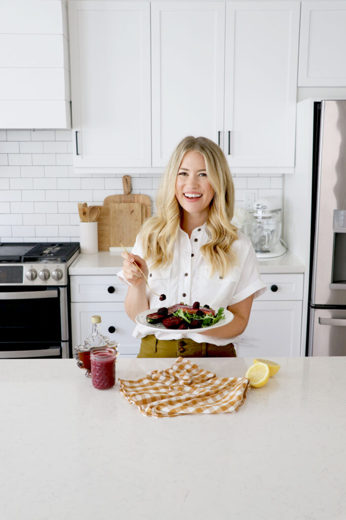 Megan enjoying a plate of salmon, zucchini & plums grilled with marinade