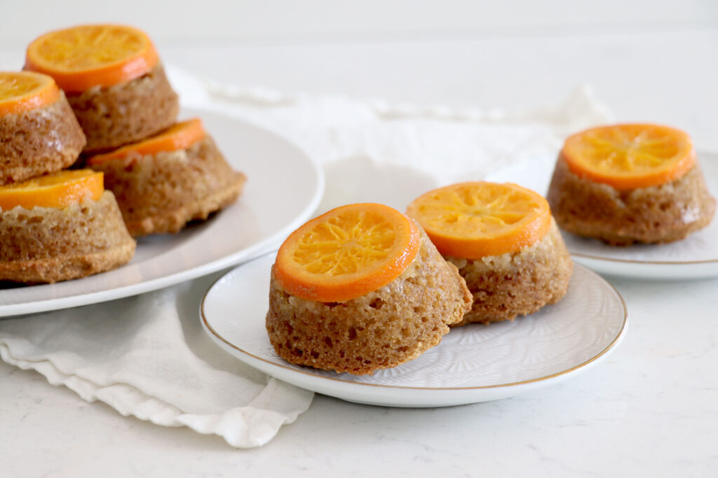 Clementine orange mini cakes on a white plate