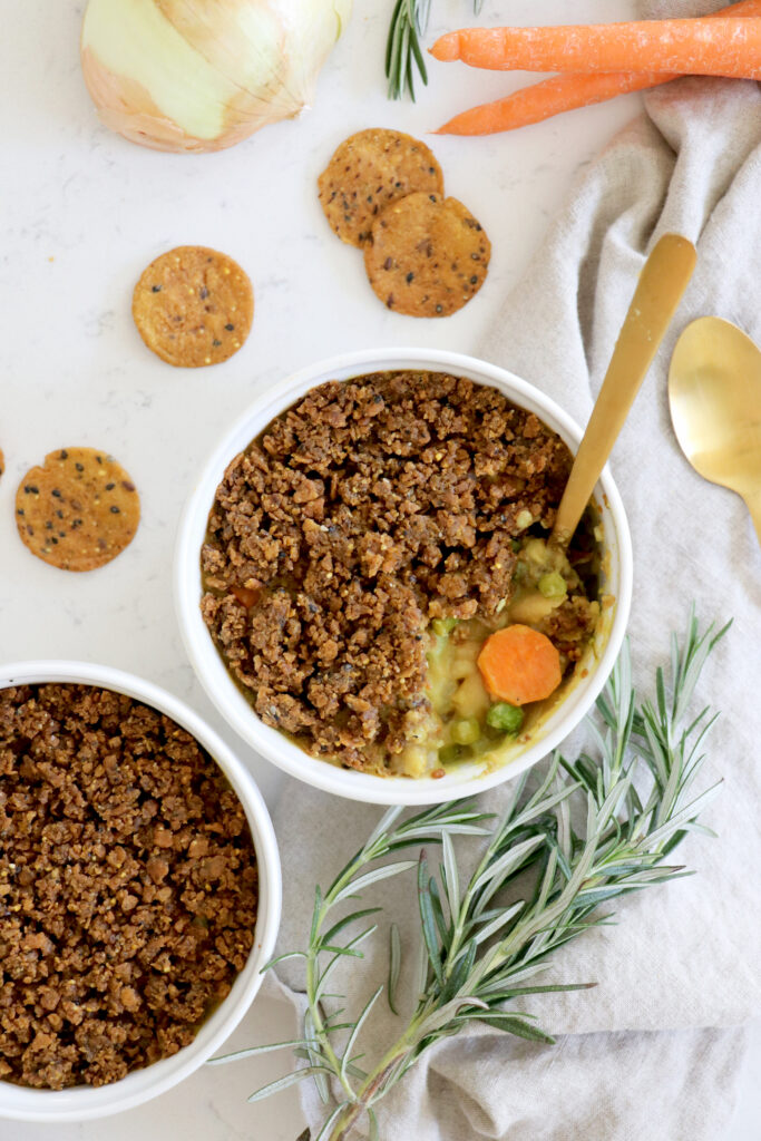 Two white ramekins with veggie pot pie.