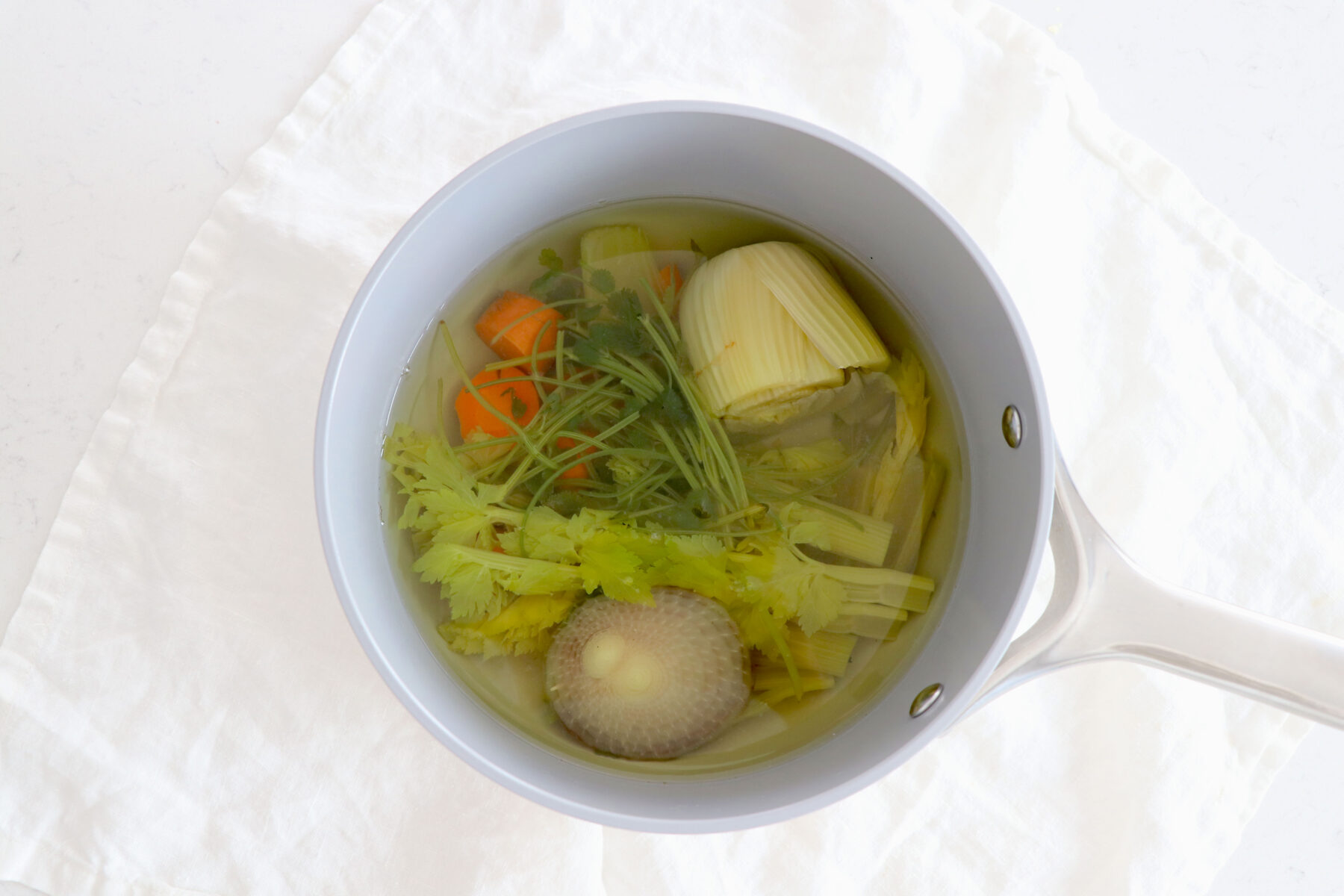 Saucepan of veggie scraps to make stock,